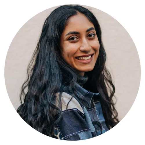 Headshot of a smiling woman with long lightly curl.jpeg