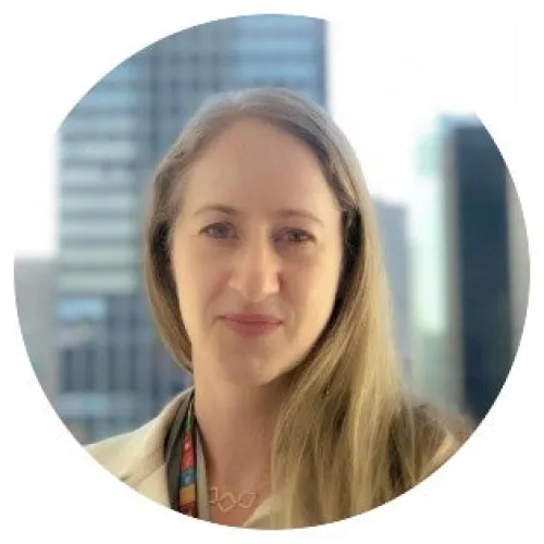 Headshot of a woman looking into the camera with l